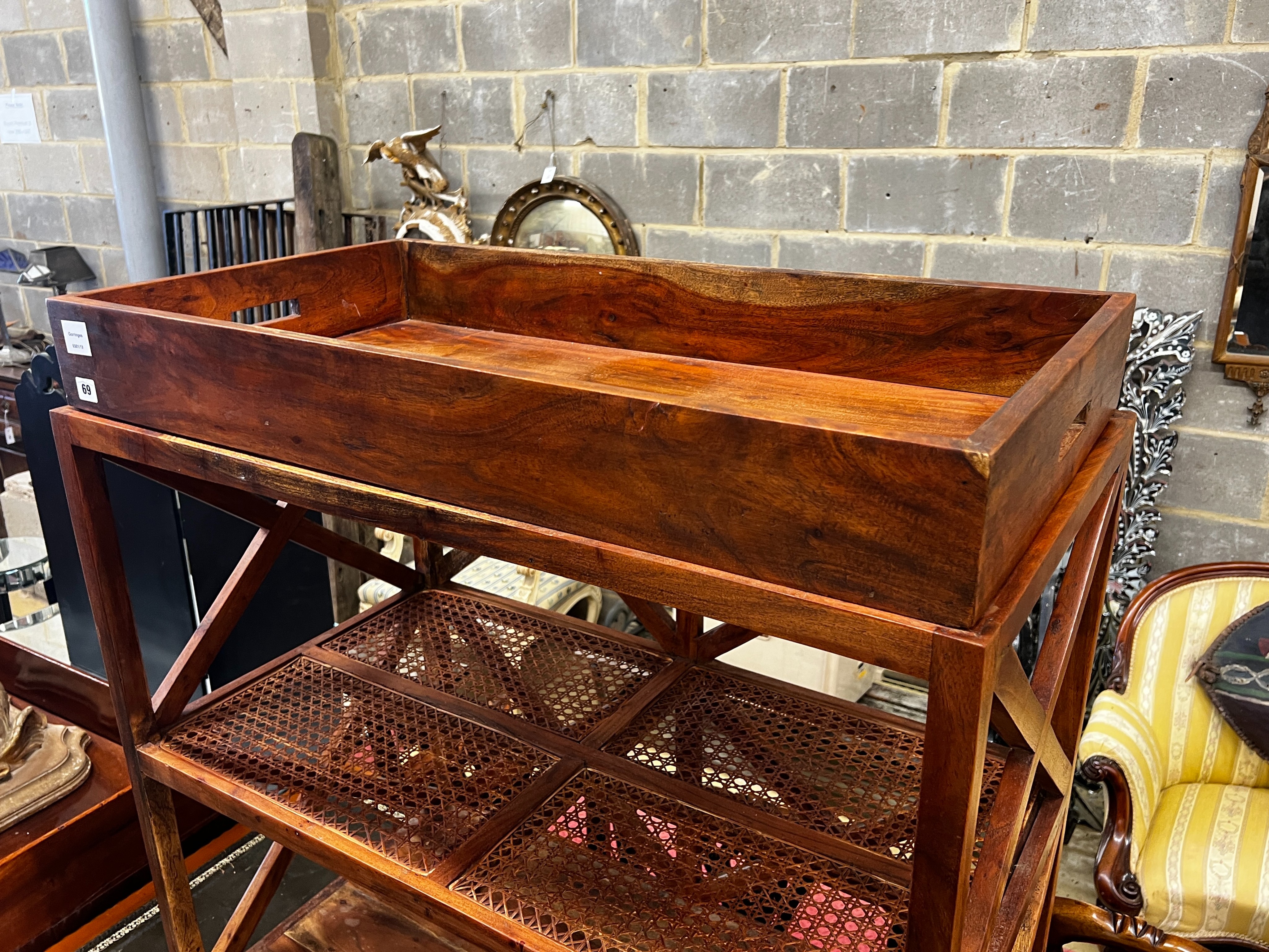 A hardwood and canework tray top three tier table, width 92cm, depth 50cm, height 96cm